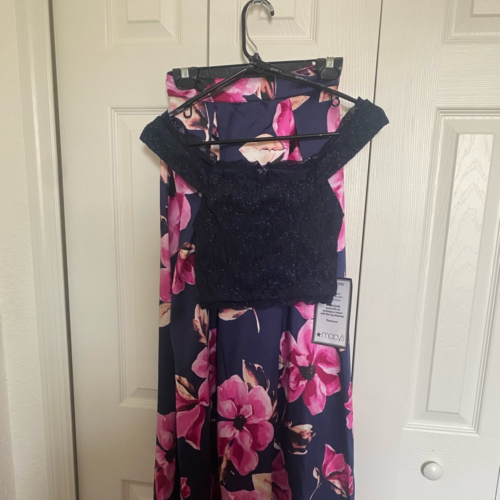 Beautifully new with tags two piece dress. Crop lace top and long satin shirt